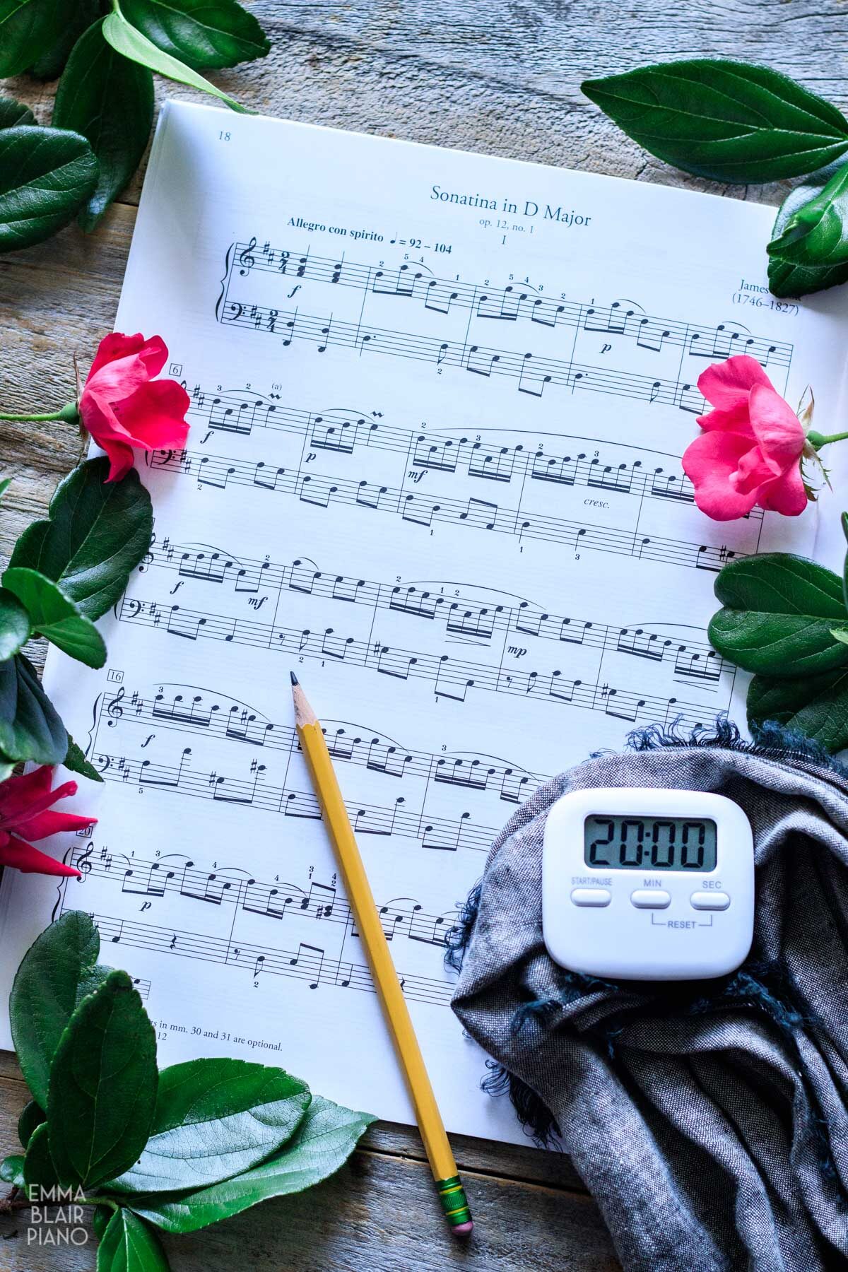 sonatina sheet music with a timer and pencil