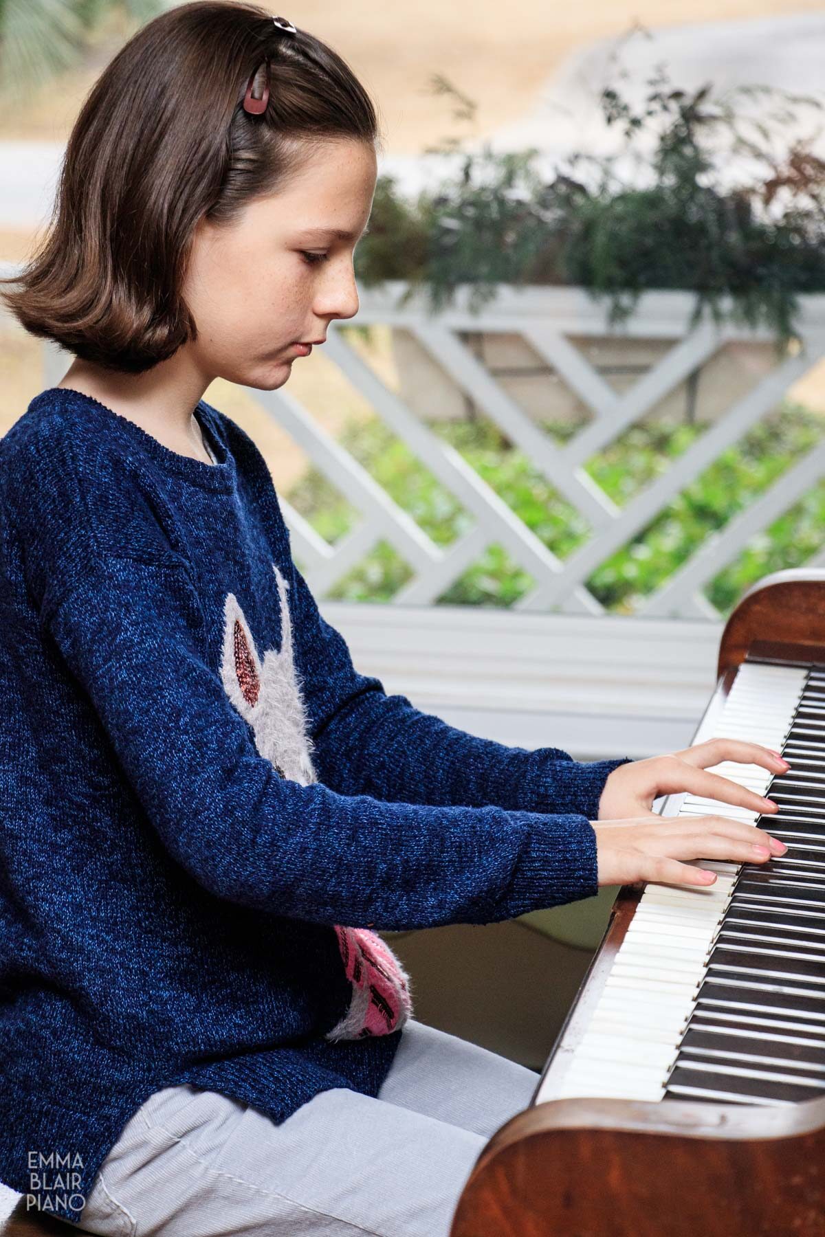 young girl playing the piano