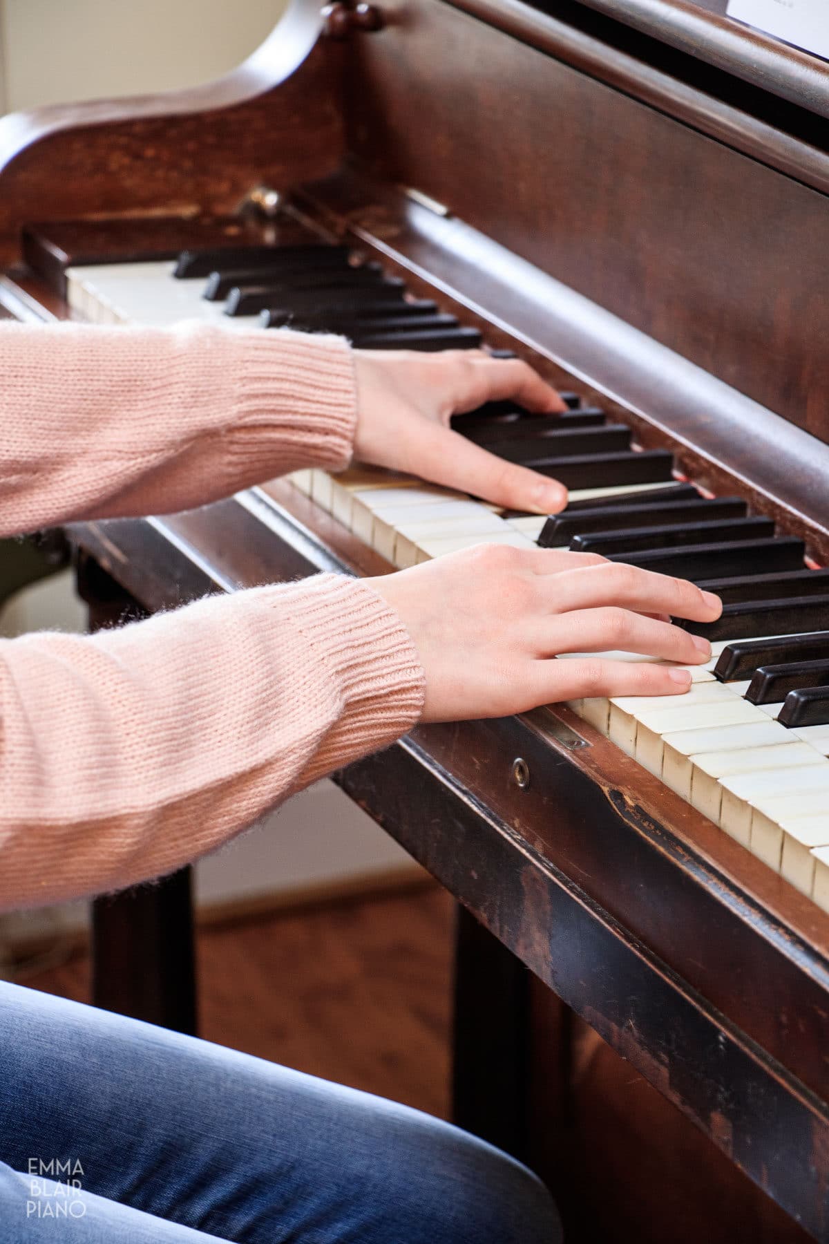 teenage girl playing the piano