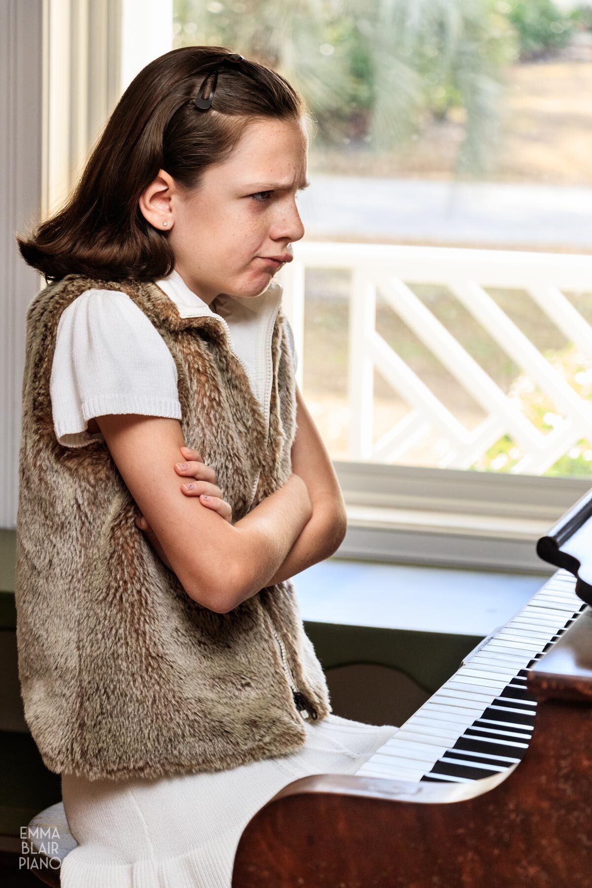 young girl frustrated with her piano music