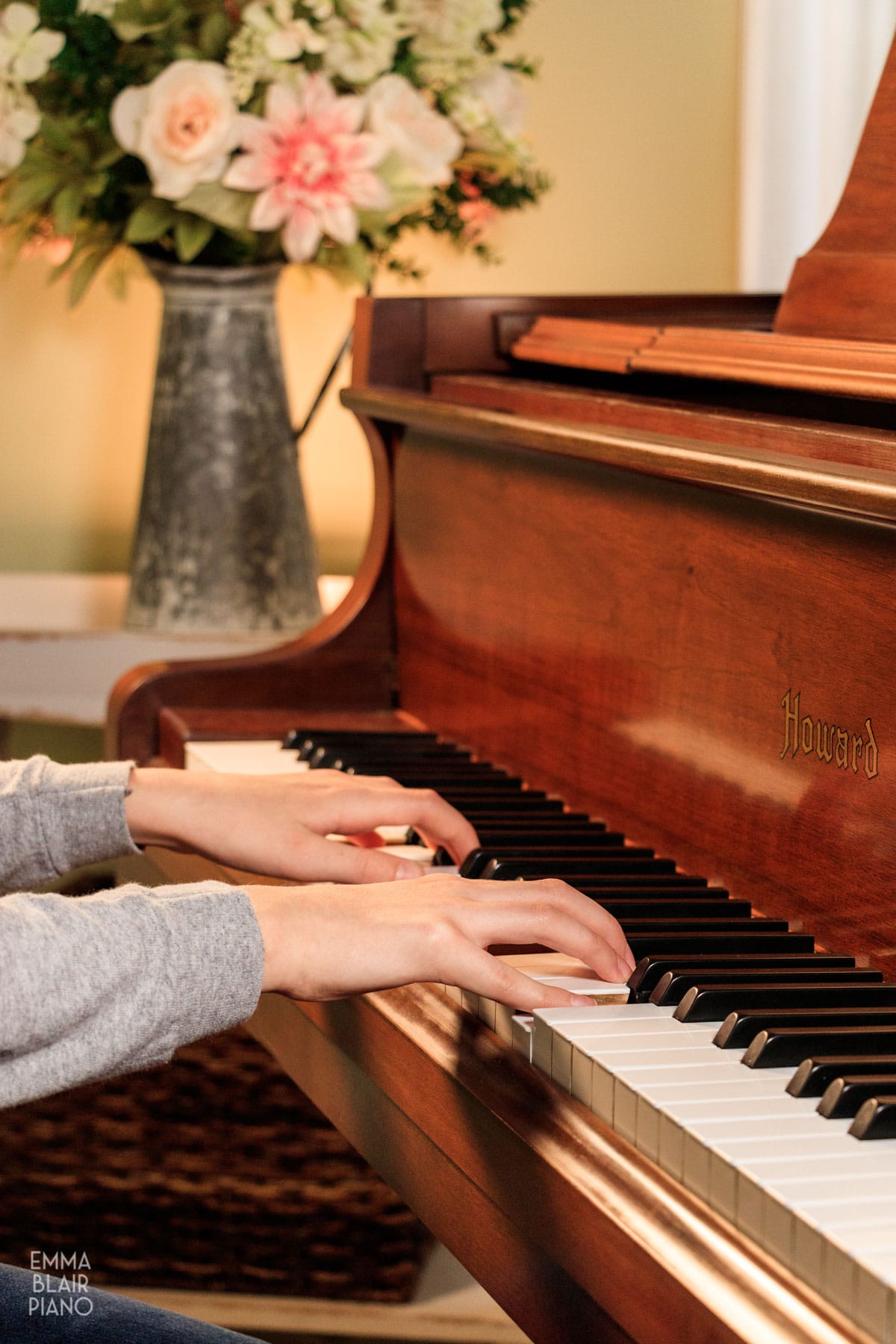 girl playing a piano keyboard