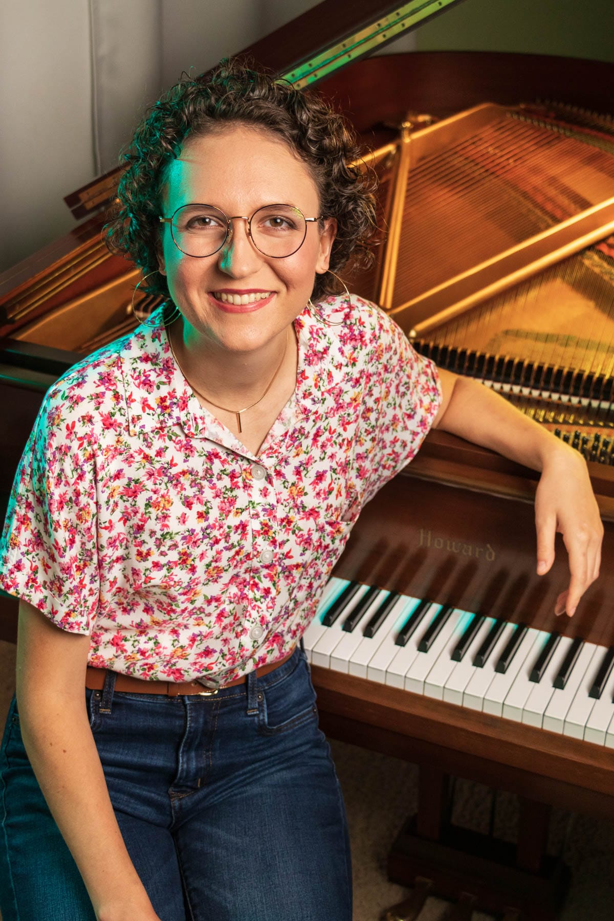 girl smiling with piano