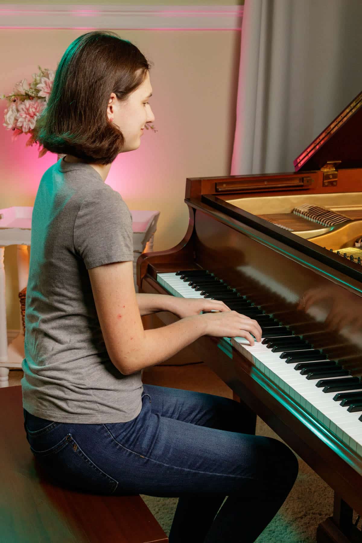 teenage girl playing piano